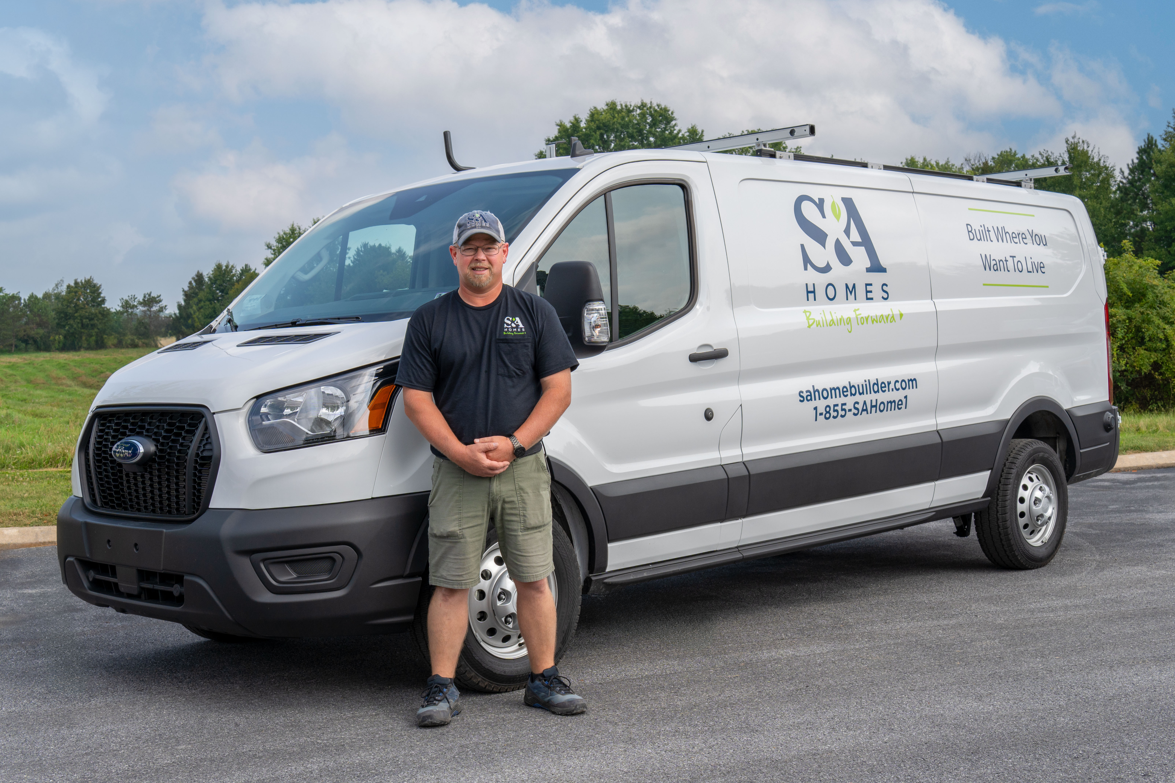 Laptop placed on a desk in a sun light lit room ready for online shopping.